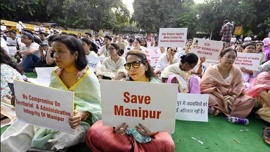 People take part in a protest organized by the Delhi Meetei Coordination Committee regarding the recent riots in Manipur, at Jantar Mantar in Delhi on Sunday. (Photo by Sanjeev Verma/HT)